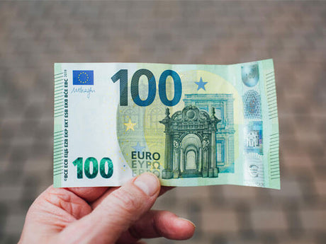 a 100 euro note held in hand