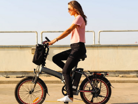 Woman riding an e-bike example of how to make your ebike fast