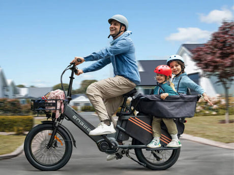 a man carries his two young children on a cargo e bike engwe le20