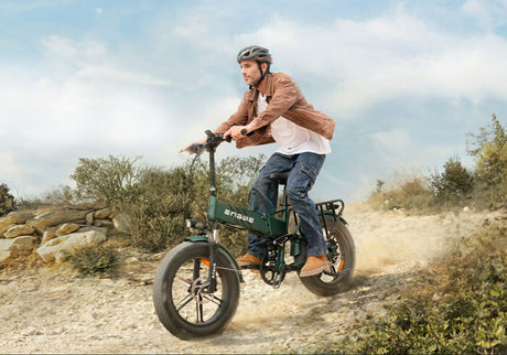 a person riding a green engwe engine pro 2.0 folding electric bike