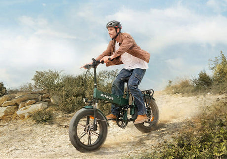 a man riding an engwe engine pro 2.0 on the sand