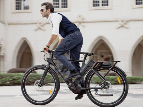 a gentleman riding a black engwe p275 pro urban bike on the road