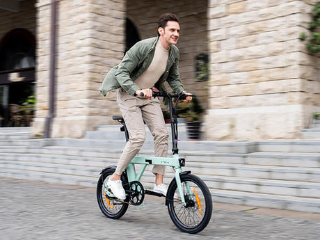 a man rides a hybrid e bike engwe p20