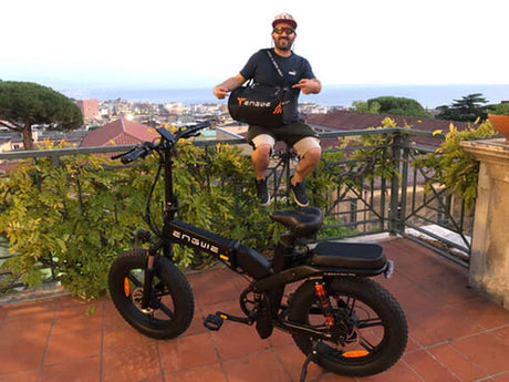 A man sits near ENGWE X20 E-Bike 