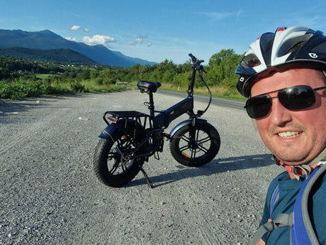 a man stands near ENGWE e-bike 