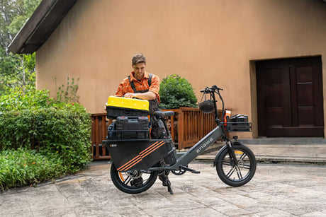 a man uses an Engwe le20 electric cargo bicycle loaded with repair tools to provide door-to-door service