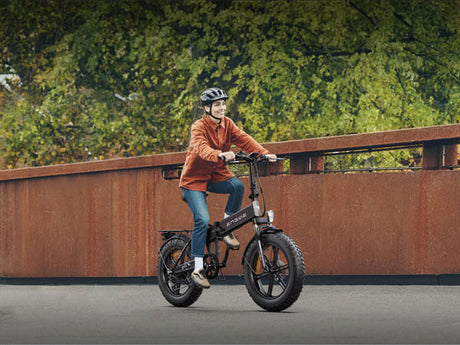 a woman happily riding an engwe ep-2 pro on the road