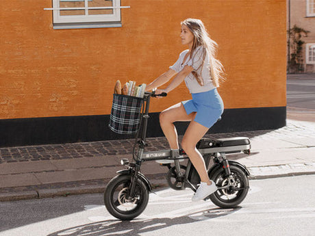 a girl riding an engwe t14 affordable e-bike 