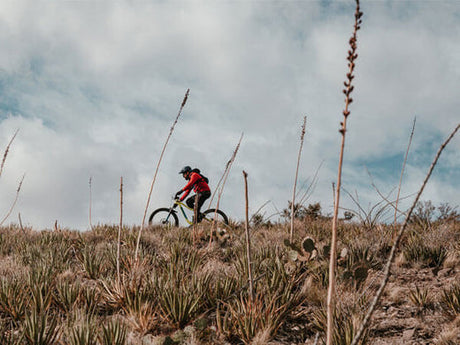 a person riding an ebike on the hillside