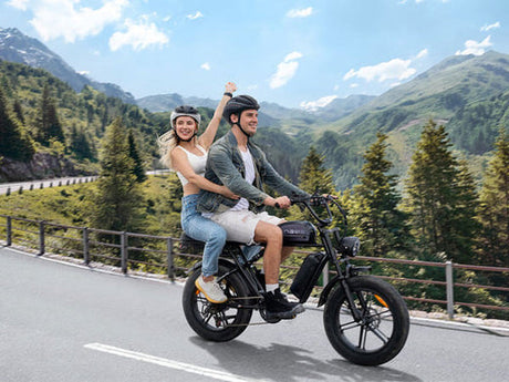 a man riding an engwe m1 fat bike on the road