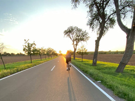 a person riding a bicycle on the road