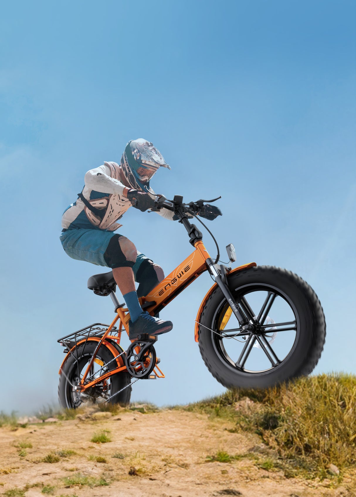 a person riding an orange engwe ep-2 pro collapsible e bike