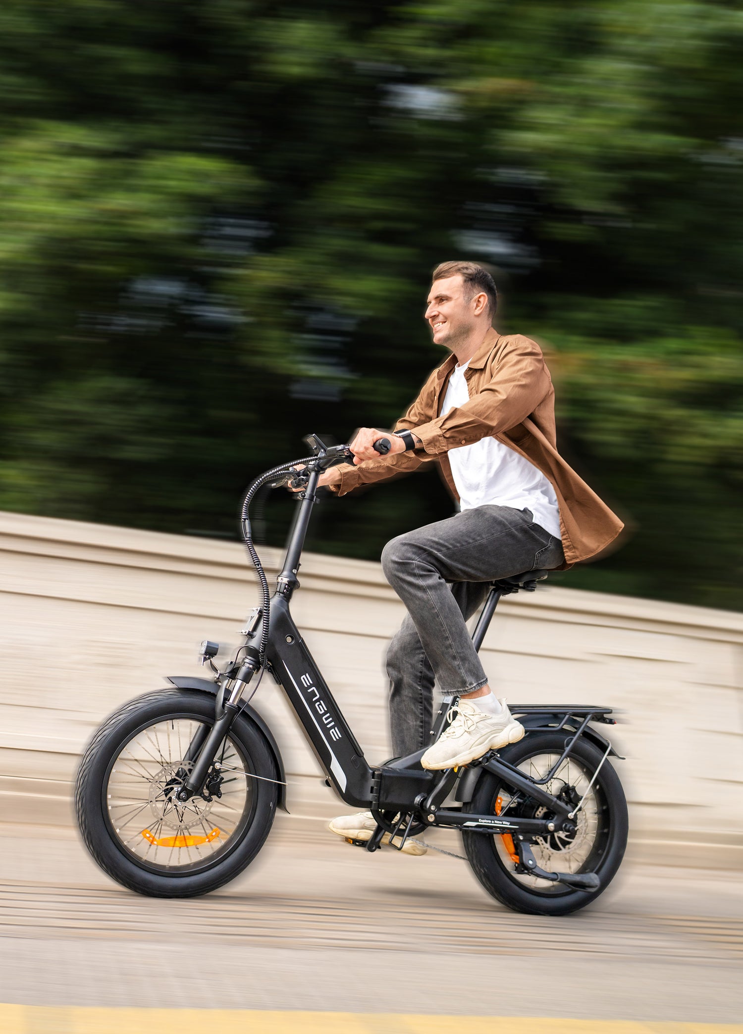 a person riding an engwe l20 3.0 boost compact ebike on the road